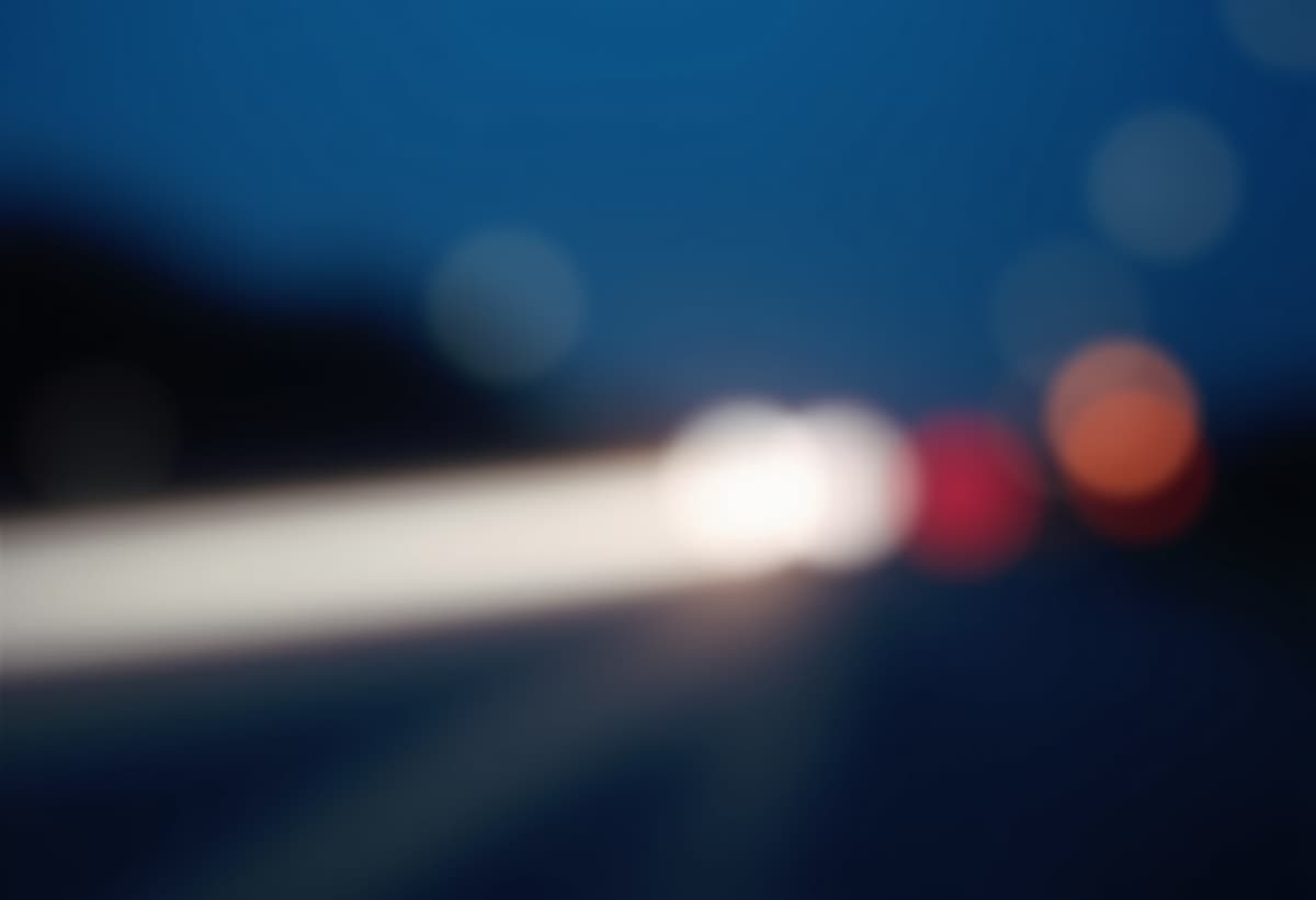 technician working on an appliance at night, showcasing emergency service