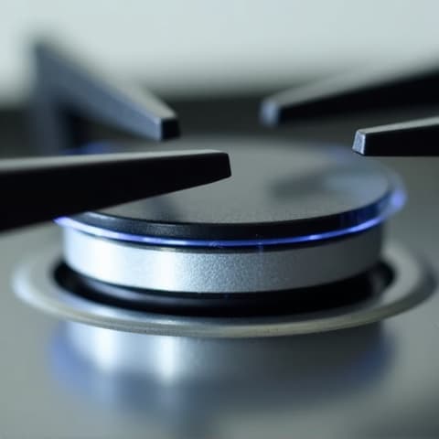 Dual Fuel Range Ignition Repair in Carmichael. Technician working on the ignition system of a dual-fuel range, highlighting the complexity of the task.